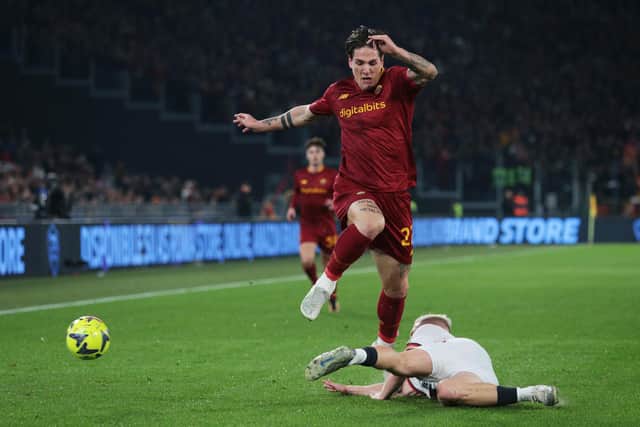 ROME, ITALY - JANUARY 12: Nicolo Zaniolo of AS Roma is challenged by Lennart Czyborra of Genoa CFC during the Coppa Italia Round of 16 match between AS Roma and Genoa CFC at Stadio Olimpico on January 12, 2023 in Rome, Italy. (Photo by Paolo Bruno/Getty Images)