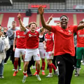 Doing it the right way: Rotherham United players celebrate staying in the Championship with a game to spare, following their 1-0 win over Middlesbrough on Monday, much to the delight of chairman Tony Stewart (Picture: Simon Hulme)