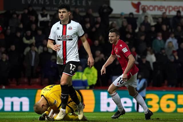 HAMMER BLOW: But ten-man Sheffield United responded to Wrexham's Paul Mullin putting his side 3-2 up late on
