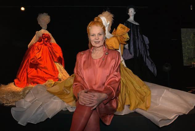 Vivienne Westwood posing with some of her designs in 2004. 
 Picture credit: Ian West/PA Photos.