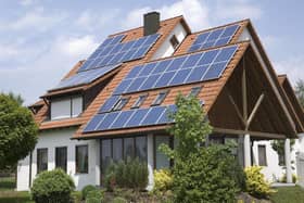 A house with solar panels fitted to its roof. PIC: PA Photo/Thinkstockphotos