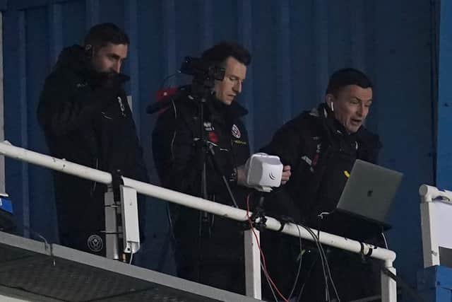 OUT OF TOUCH: Sheffield United manager Paul Heckingbottom (right) watches on from the press area as his side beat hosts Reading, the Blades boss serving the third game of a three-game touchline ban  Picture: Nick Potts/PA