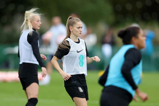 TEDDINGTON, ENGLAND - OCTOBER 04: Jess Park of England (C) looks on during an England Women Training Session at The Lensbury on October 04, 2022 in Teddington, England. (Photo by Catherine Ivill/Getty Images)