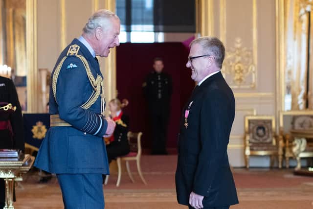 Mike Downey receiving his OBE medal in May from the man who has since become King Charles III. Picture by British Ceremonial Arts Ltd.