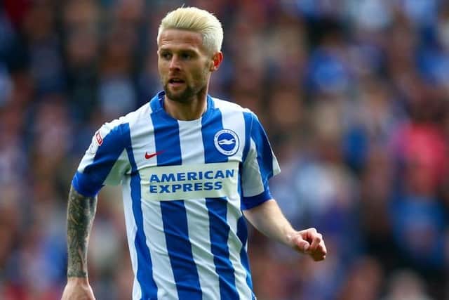 FORMER PLAYER: Oliver Norwood had a spell in Brighton and Hove Albion's midfield