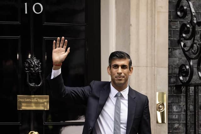 British Prime Minister Rishi Sunak waves to members of the media after taking office outside Number 10 in Downing Street on October 25. (Pic credit: Dan Kitwood / Getty Images)