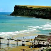 Saltburn-by-the-Sea pier against a backdrop of people on the beach. (Pic credit: Gary Longbottom)