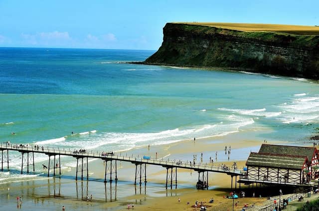Saltburn-by-the-Sea pier against a backdrop of people on the beach. (Pic credit: Gary Longbottom)
