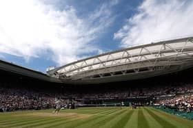 Novak Djokovic of Serbia serves against Nick Kyrgios of Australia during their Men's Singles Final match on day fourteen of The Championships Wimbledon 2022 at All England Lawn Tennis and Croquet Club on July 10, 2022 in London, England. (Photo by Julian Finney/Getty Images)