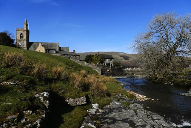 Gayle Beck runs through Hawes, with a view of St Margaret's Church in the Yorkshire Dales.