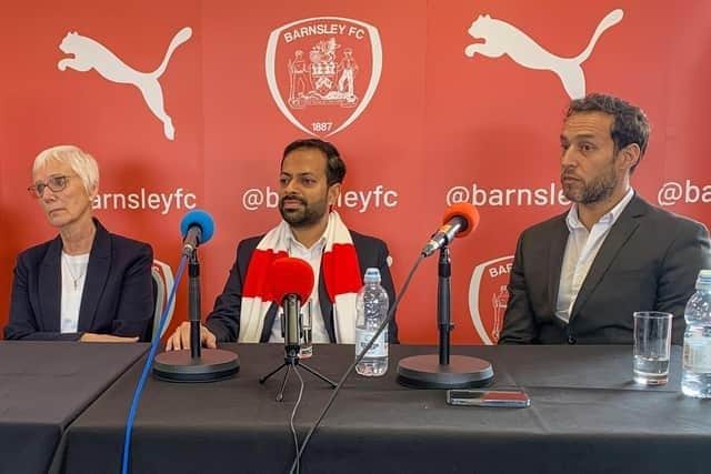 Barnsley chairman Neerav Parekh (centre), flanked by director Jean Cryne and outgoing CEO Khaled El-Ahmed.