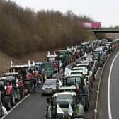 French farmers of the CR47 union (Coordination rurale 47) block the A16 highway near Beauvais, on January 30, 2024, amid nationwide protests called by several farmers unions on pay, tax and regulations, in Beauvais. Farmers protests across Europe are growing as they demand better conditions to grow produce and maintain a proper income. (Photo by Sameer Al-Doumy / AFP)