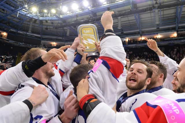 SWEET DREAMS ARE MADE OF THIS: Robert Dowd (third right) celebrates  with his GB team-mates after winning gold and promotion back to the top tier of the World Championships in Nottingham back in May. Picture: Dean Woolley/Ice Hockey UK
