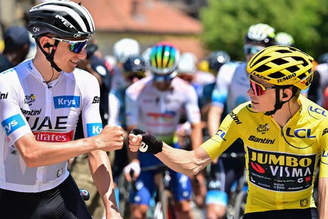 UAE Team Emirates' Slovenian rider Tadej Pogacar wearing the best young rider's white jersey (L) bumps fists with Jumbo-Visma's Danish rider Jonas Vingegaard wearing the overall leader's yellow jersey (R) before the start of the 9th stage (Picture: MARCO BERTORELLO/AFP via Getty Images)