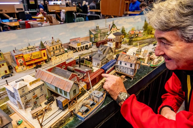 Mike Carter of Summerset, with his award winning 1940s 'Red Hook Bay' New England USA layout a fictitious busy seaport on the coast of Maine, USA. Beside the local fishing industry, Red Hook Bay is host to a brewery and a dairy. The town is a major transportation hub for the coastal islands of the coast of Maine and has ferry services from the wharf for both passengers and cars. The town is also a railroad junction for Boston & Maine and Maine Central railroads. It is also served by local tram services with a tram stop in front of Hokum's Burlesque Theatre and the Topless Bar in Main Street.