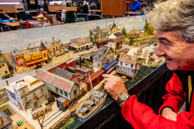 Mike Carter of Summerset, with his award winning 1940s 'Red Hook Bay' New England USA layout a fictitious busy seaport on the coast of Maine, USA. Beside the local fishing industry, Red Hook Bay is host to a brewery and a dairy. The town is a major transportation hub for the coastal islands of the coast of Maine and has ferry services from the wharf for both passengers and cars. The town is also a railroad junction for Boston & Maine and Maine Central railroads. It is also served by local tram services with a tram stop in front of Hokum's Burlesque Theatre and the Topless Bar in Main Street.