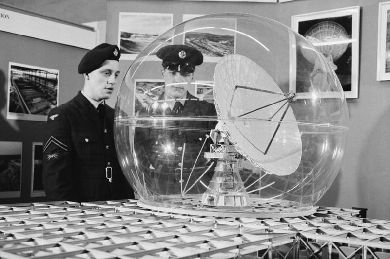 Unspecified military personnel inspect a model of the Ballistic Missile Early Warning System (BMEWS) on display at the Air Ministry exhibition in Whitehall, London, England, May  21 1962. Later that year, BMEWS was installed at RAF Fylingdales on the North York Moors.