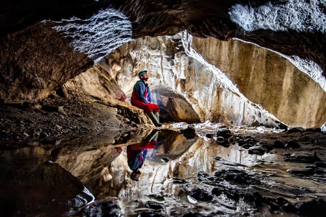 Pictured Richard Goodey, from Lost Earth Adventures, admiring the amazing internal cave structure of the Valley Entrance which leads to the Kingsdale Master Cave near Ingleton in the heart of the Yorkshire Dales.