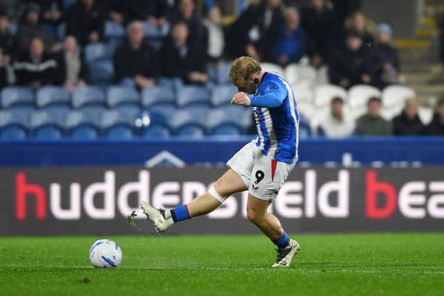 Huddersfield Town striker Joe Taylor scores the hosts' second goal - against his former club. Picture: Jonathan Gawthorpe