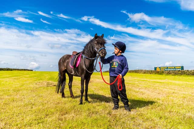 Charlie Hampshire, aged nine, with his pony called Merry, they hope to be competing in the equine section of the show