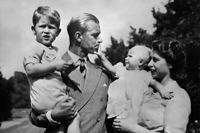 Queen Elizabeth II, and her husband Philip, Duke of Edinburgh, with their two children, Charles, Prince of Wales (L) and Princess Anne (R), circa 1951.