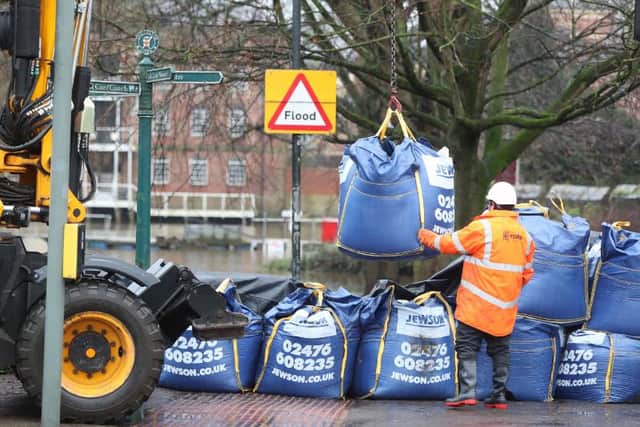Workmen prepare flood defences near the River Ouse, York, as Storm Christoph is set to bring widespread flooding, gales and snow to parts of the UK. (Pic: PA)