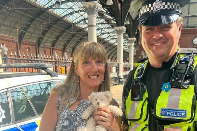 Linda Lawson and PC Rob Simpson with her teddy bear