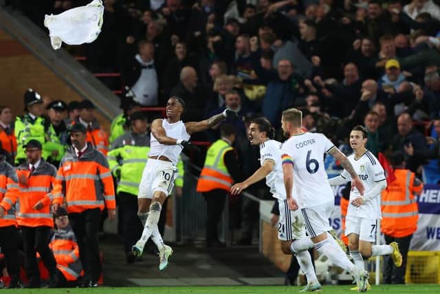 ELATION: Crysencio Summerville (left) celebrates scoring Leeds United's winner at Anfield