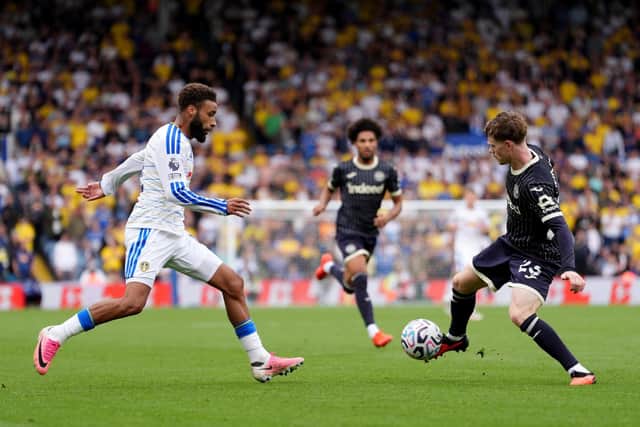 STRUGGLES: Jayden Bogle (left) closes down Brentford's Keane Lewis-Potter (Image: Press Association)