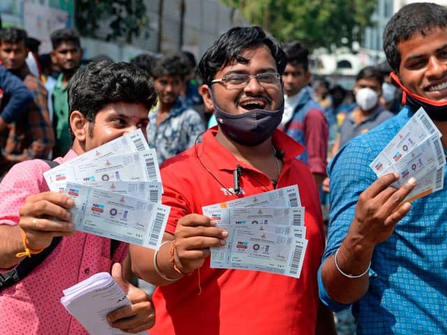 Cricket fans display tickets for the Test match between India and England. (Pic: Getty Images)