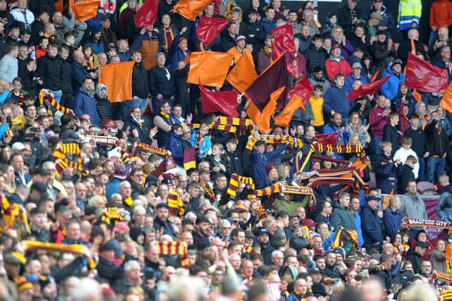 BACKING: Bradford City's fans celebrate making it into the League Two play-offs after the 1-1 draw with League Two champions Leyton Orient. at the end. Picture: Simon Hulme