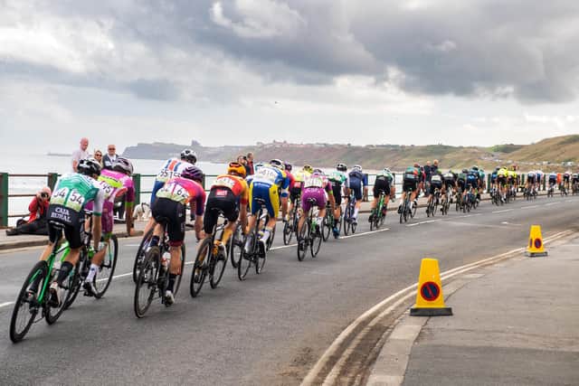 The Tour of Britain peloton passes under grey clouds through Sandsend en route to Whitby on 7 September, 2022. (Picture: Bruce Rollinson)