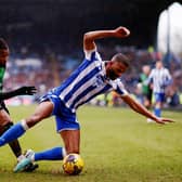 SHEFFIELD, ENGLAND - JANUARY 20: Michael Ihiekwe of Sheffield Wednesday is challenged by Kasey Palmer of Coventry City during the Sky Bet Championship match between Sheffield Wednesday and Coventry City at Hillsborough on January 20, 2024 in Sheffield, England. (Photo by Naomi Baker/Getty Images)