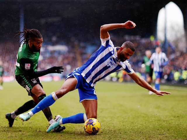 SHEFFIELD, ENGLAND - JANUARY 20: Michael Ihiekwe of Sheffield Wednesday is challenged by Kasey Palmer of Coventry City during the Sky Bet Championship match between Sheffield Wednesday and Coventry City at Hillsborough on January 20, 2024 in Sheffield, England. (Photo by Naomi Baker/Getty Images)