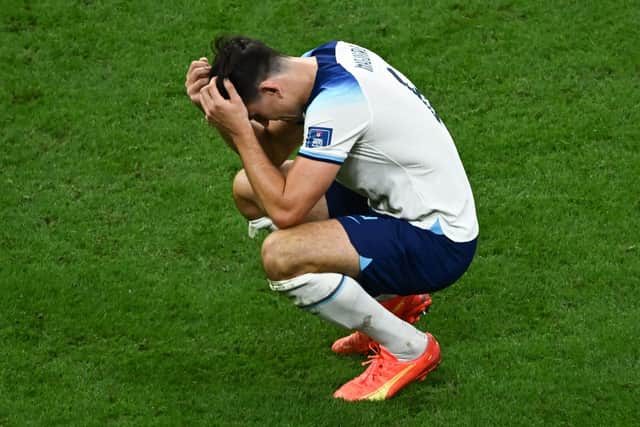 England's defender Harry Maguire reacts to his team's defeat in the Qatar 2022 World Cup quarter-final football match between England and France (Picture: JEWEL SAMAD/AFP via Getty Images)