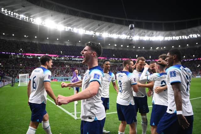 DOHA, QATAR - NOVEMBER 29: Declan Rice of England leads the celebrations as Phil Foden is congratulated on scoring the second goal   during the FIFA World Cup Qatar 2022 Group B match between Wales and England at Ahmad Bin Ali Stadium on November 29, 2022 in Doha, Qatar. (Photo by Laurence Griffiths/Getty Images)