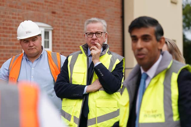 Prime Minister Rishi Sunak and Michael Gove, Minister for Levelling Up, Housing and Communities, during a visit to a housing development. PIC: Joe Giddens/PA Wire