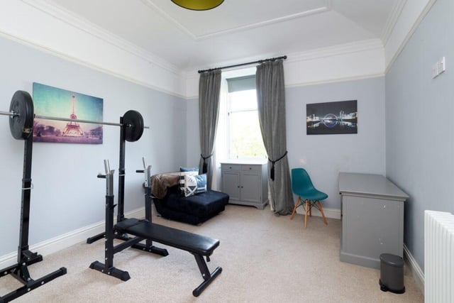 One of the bedrooms is currently being used as a gym space.