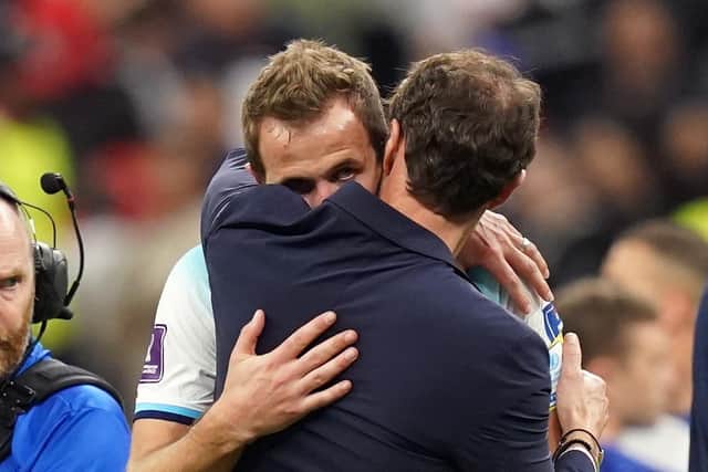 England's Harry Kane is consoled by manager Gareth Southgate following defeat in the FIFA World Cup Quarter-Final match at the Al Bayt Stadium in Al Khor, Qatar. Picture: Adam Davy/PA Wire.