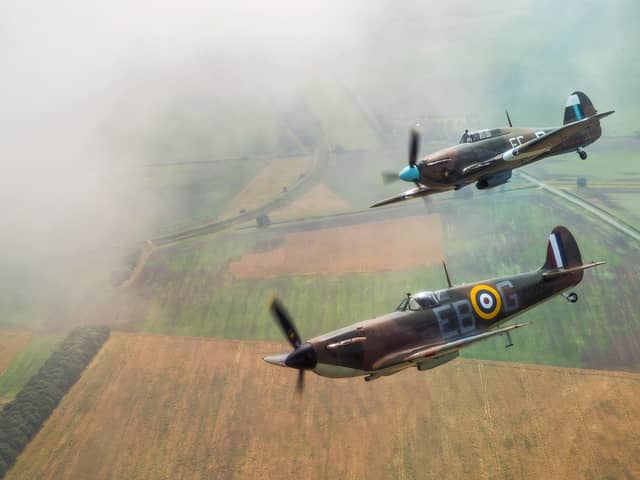 Battle of Britain Memorial Flight (BBMF) flypast of Spitfire (P7350) and Hurricane (PZ865).A synchronised turn over the Lincolnshire countryside