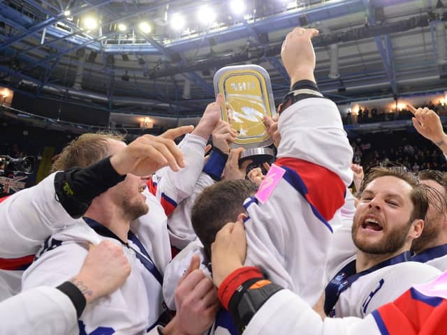 PARTY TIME: Sheffield Steelers' Rob Dowd, Jonathan Phillips and Davey Phillips celebrate winning the World Championship Division 1A trophy in Nottingham. Picture courtesy of Dean Woolley/Ice Hockey UK