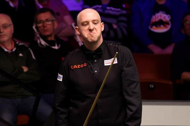 SHEFFIELD, ENGLAND - APRIL 18: David Grace of England reacts during their round one match against John Higgins of Scotland on Day Four of the Cazoo World Snooker Championship 2023 at Crucible Theatre on April 18, 2023 in Sheffield, England. (Photo by George Wood/Getty Images)