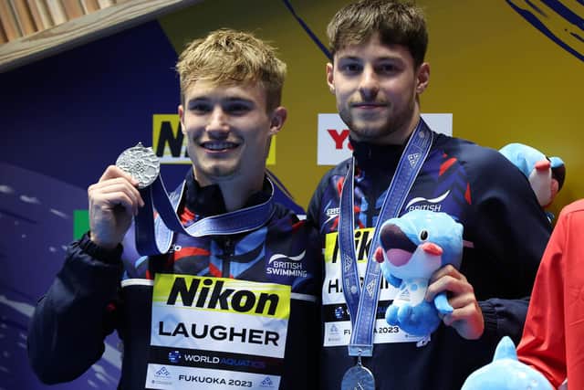 Silver medalists Jack Laugher and Anthony Harding of Team Great Britain and the City of Leeds Diving Club pose for photos during the medal ceremony for the Men’s Synchronized 3m Springboard (Picture: Sarah Stier/Getty Images)