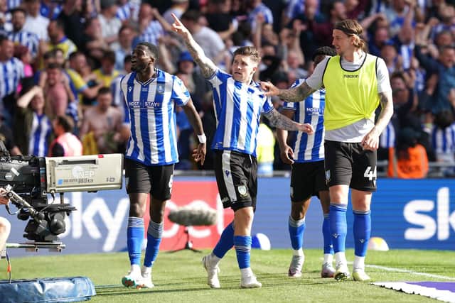 Sheffield Wednesday's Josh Windass (centre) celebrates scoring their side's first goal of the game with team-mats during the Sky Bet League One play-off final at Wembley Stadium, London. Picture date: Monday May 29, 2023. PA Photo. See PA story SOCCER Final. Photo credit should read: Nick Potts/PA Wire.RESTRICTIONS: EDITORIAL USE ONLY No use with unauthorised audio, video, data, fixture lists, club/league logos or "live" services. Online in-match use limited to 120 images, no video emulation. No use in betting, games or single club/league/player publications.