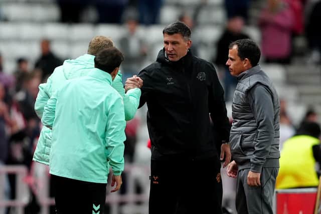 Hull City manager Sergej Jakirovic (centre) congratulates the Sunderland coaching staf including manager Regis Le Bris (right) at the final whistle after the Carabao Cup third round match at the Stadium of Light, Sunderland. Picture date: Tuesday September 8, 2026.