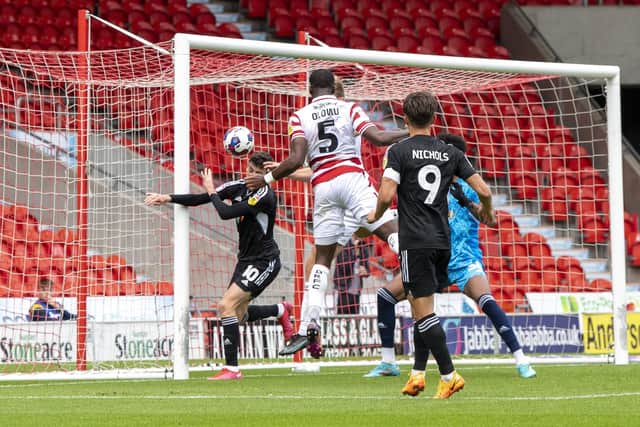 OPENING GOAL: Joseph Olowu heads Doncaster Rovers in front against Crawley Town