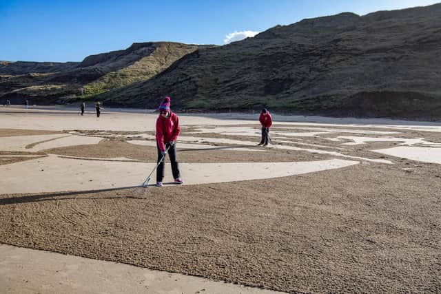 Liz Warrington and Peter McKenna from Sand in Your Eye work with land sand art at Cayton Bay near Scarborough featuring Prime Minister Rishi Sunak with a fish in his mouth and the strapline #EndDestructiveFishing, a Oceana UK campaign exposing the fishing and destructive trawling taking place in the UK's marine protected areas.
Photographed by Tony Johnson for The Yorkshire Post.