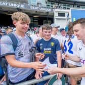 Harry Brook signs autographs for young fans after the Headingley Ashes Test in July. Picture by Allan McKenzie/SWpix.com