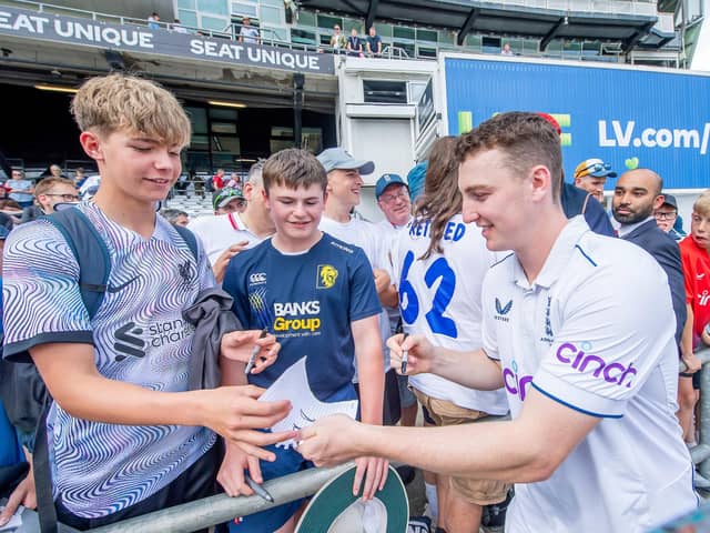 Harry Brook signs autographs for young fans after the Headingley Ashes Test in July. Picture by Allan McKenzie/SWpix.com