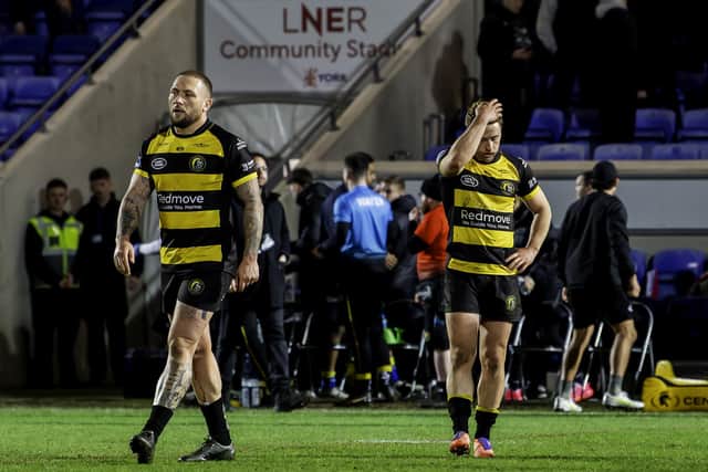 Josh Griffin, left, and Danny Richardson show their disappointment after the defeat to Warrington. (Photo: Allan McKenzie/SWpix.com)